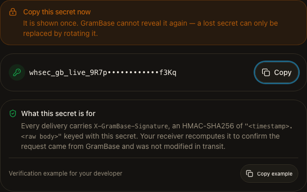 GramBase's one-time webhook signing secret reveal after creating an endpoint, shown once with a verification snippet for the developer.